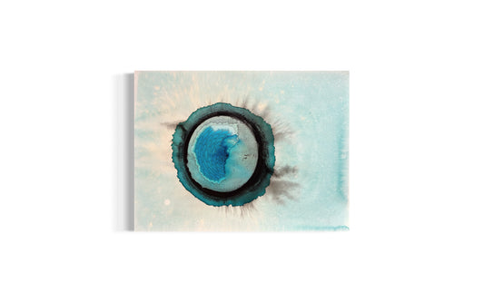 Abstract art piece with a central blue circle on a watercolor background