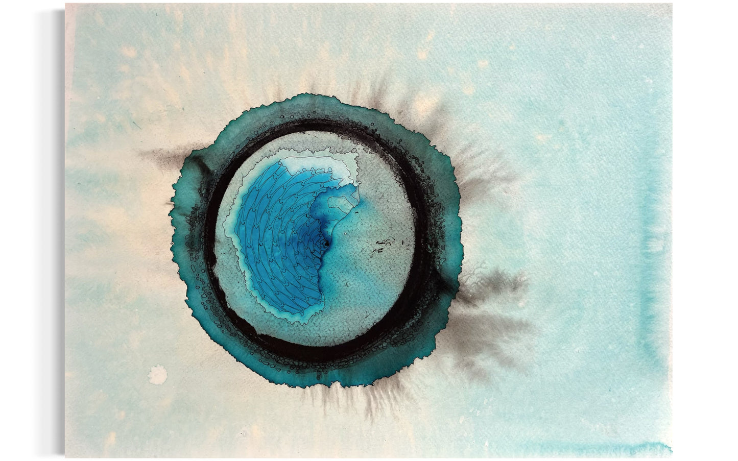 Abstract art piece with concentric circular patterns in blue and green on a light background